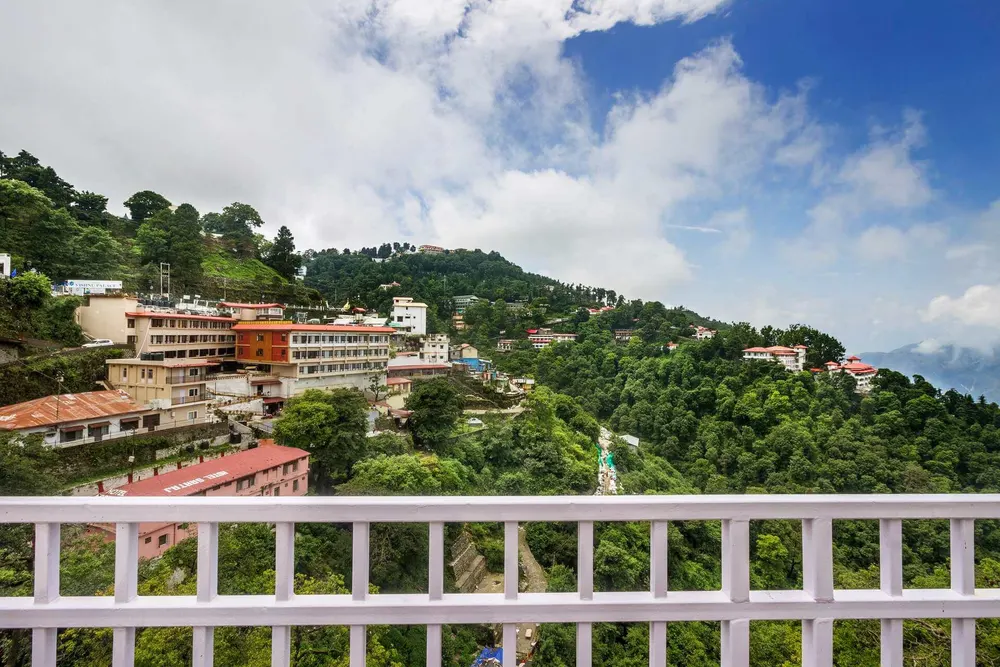 The hillside view from a balcony at EllBee Mussoorie Hills